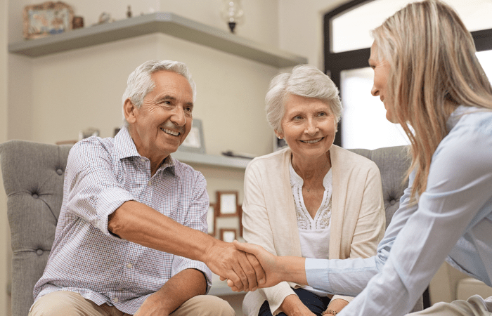 Agent selling final expense insurance to a senior couple.