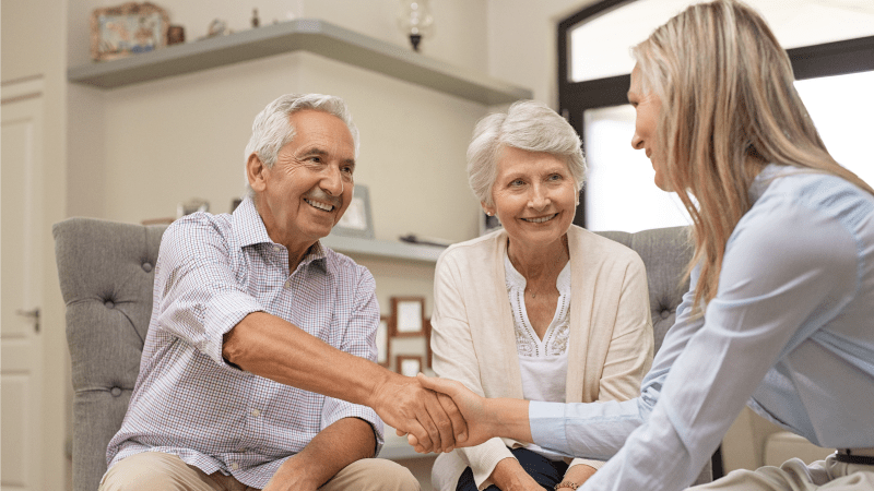 Agent selling final expense insurance to a senior couple.