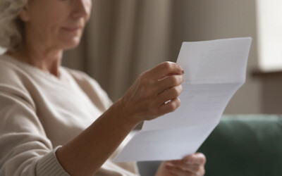 An image of a senior reading a direct mail piece.