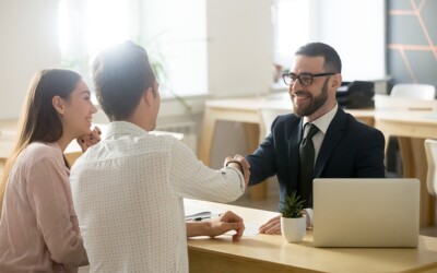 Insurance agent closing a sale with a potential client.