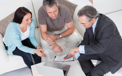 Mortgage protection agent discussing policies with clients.