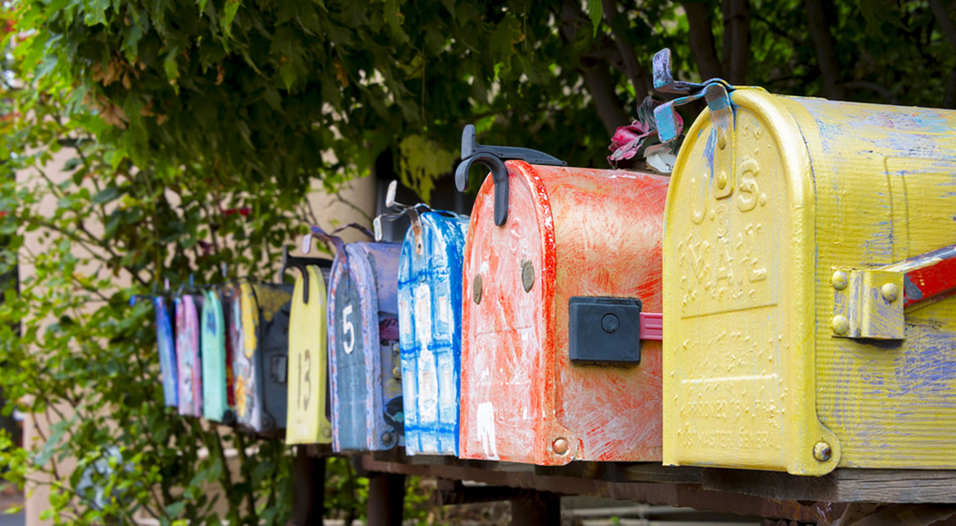 Row of multicolored mailboxes for direct mail marketing