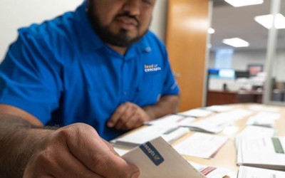 Image of a Lead Concepts employee organizing exclusive direct mail insurance leads.