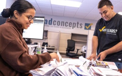 Two Lead Concepts employees organizing exclusive leads.
