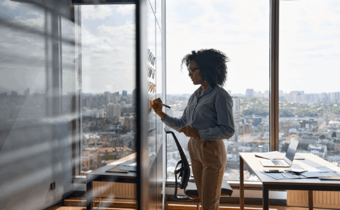 Seminar audience clapping together for host.